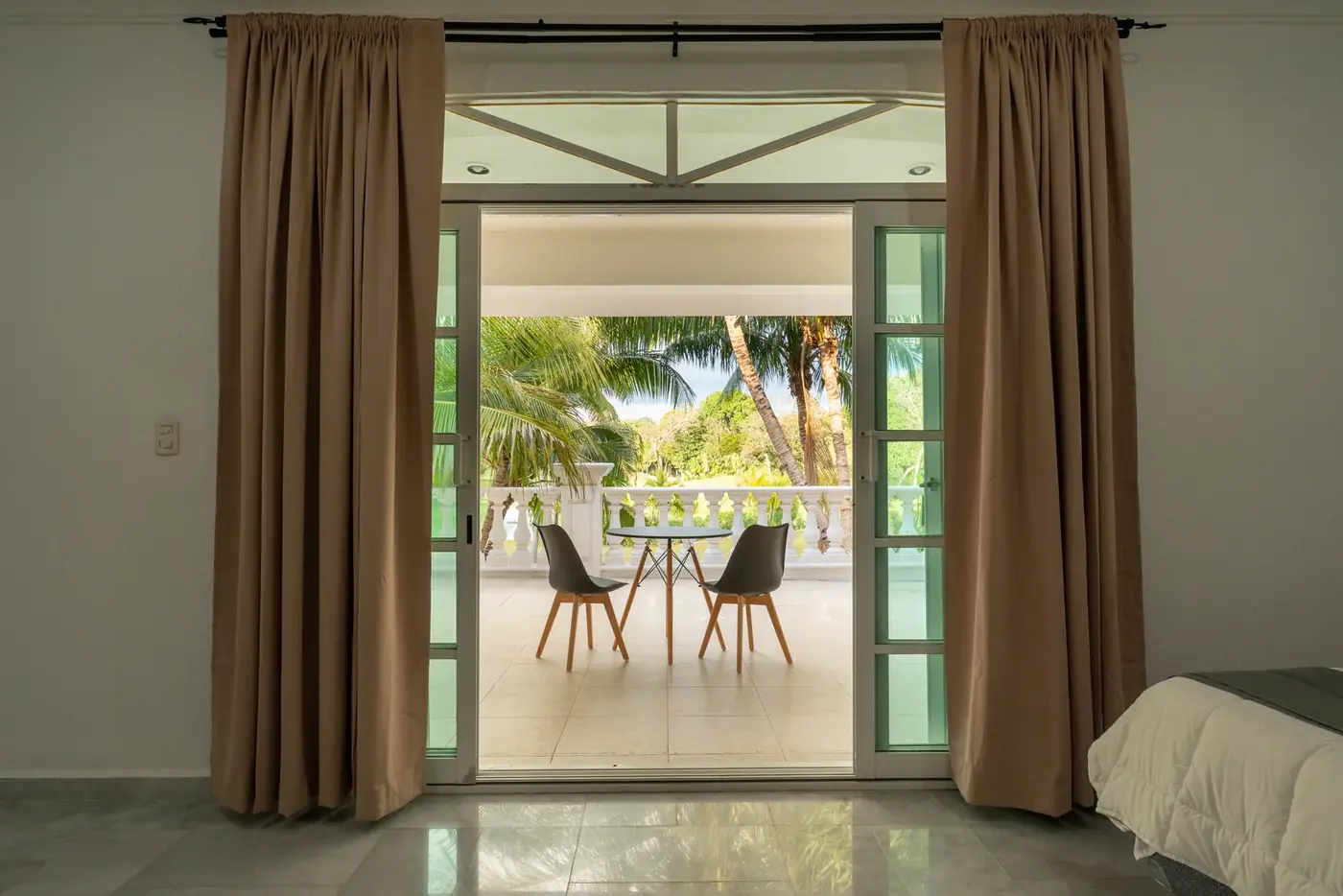 A private patient room at Ibogaine Clinic in Playa del Carmen, looking out to the grounds