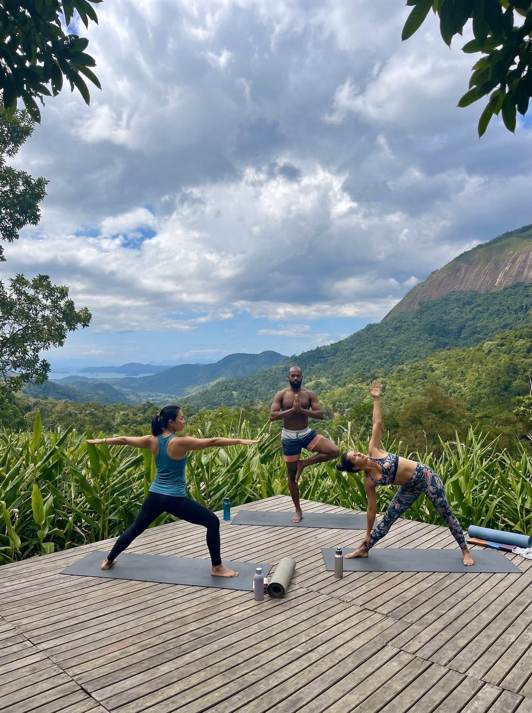 Students doing yoga on the grounds of Nekawa Ibogaine Treatment Centers in Paraty, Brazil