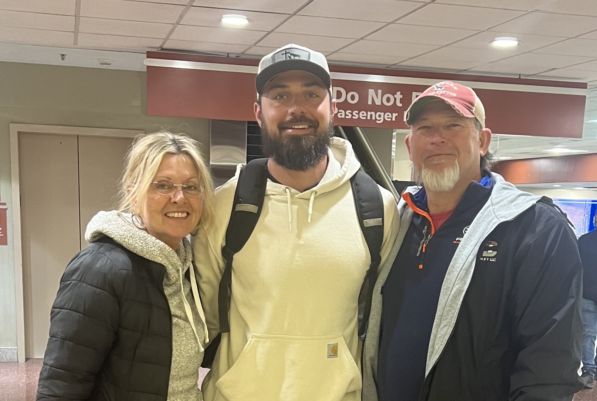 Diane, Tom, and Chase Hall at the airport upon arriving from Mexico.